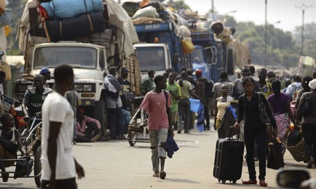 Muslim civilians prepare to board trucks in Bangui to flee violence
